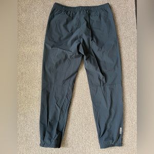 REI black running pants. Light weight, zipper pockets. Medium size.
